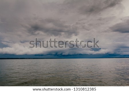 Photo of a freshwater river and amazing storm approaching the background. Photo of Mato Grosso do Sul, Brazil.