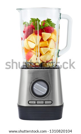 Stationary blender filled with slices of apples, pumpkins, strawberries for making smoothie. Royalty-Free Stock Photo #1310820104