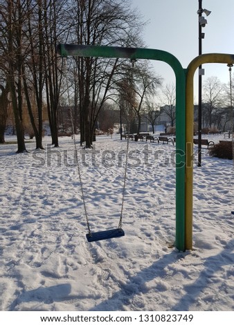 Colors on the white snow - playground in winter