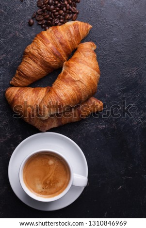 Top view of traditional croissants with hot coffee. Golden croissants.