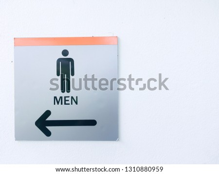 Restroom or men toilet  arrow directions left sign with copy space
