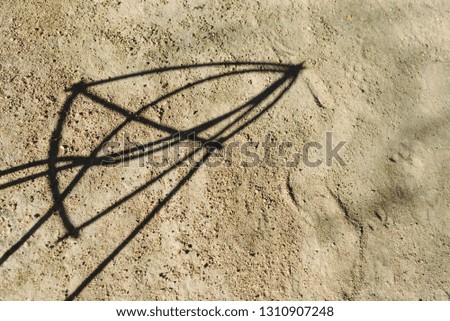 Earth background with abstract shadows of metal sticks