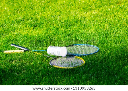 Tennis equipment left on the grass of stadium 