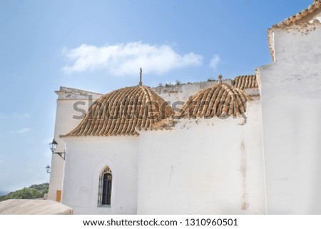White houses against blue sky in the historic old town of Ibiza, Spain. Travel, architecture and mediterranean background.