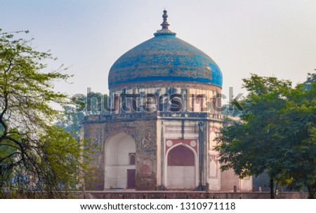Humayun's Tomb in New Delhi, India - Majestic views of the first garden-tomb on the Indian subcontinent. The Tomb is an excellent example of Persian architecture. Located in the Nizamuddin East Delhi. Royalty-Free Stock Photo #1310971118