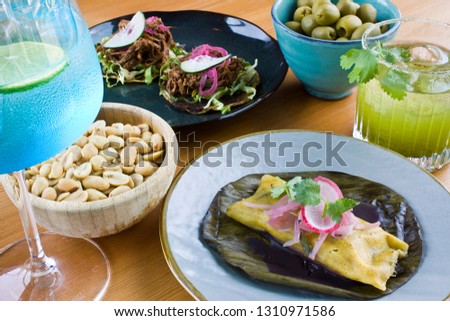 Mexican appetizer with drinks and food