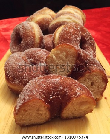 Zeppole, ciambelle fritte, fatti fritti, para frittus, italian traditional donuts Royalty-Free Stock Photo #1310976374