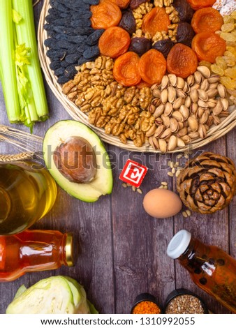 tocopherol or vitamin E rich food in wooden board Royalty-Free Stock Photo #1310992055