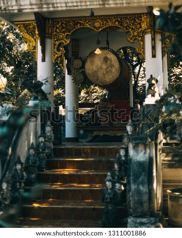 Drum building in lush green temple,temple alarm drum 