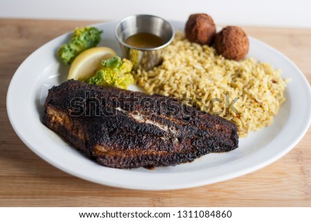 Blackened Catfish Plate Royalty-Free Stock Photo #1311084860