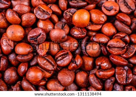 Seeds of fragrant coffee on a dark concrete background. It can be used as a background