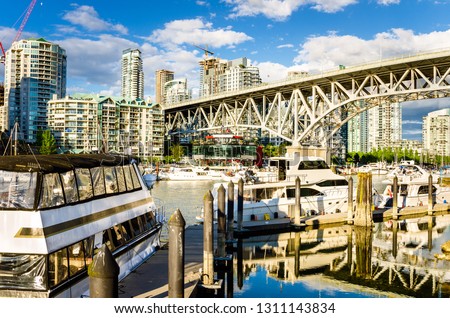 Moored Boats under Granville Bridge in Vancouver, Canada, on a Sunny Summer Day