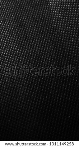 Non woven fabric pattern texture background. High contrast black and white.