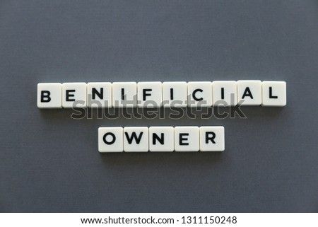 Beneficial owner word made of square letter word on grey background. Royalty-Free Stock Photo #1311150248