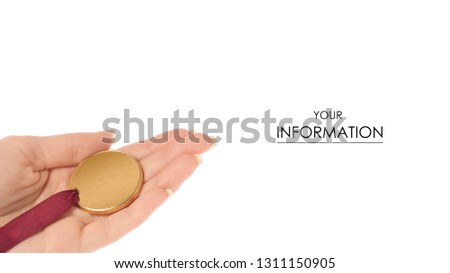 A gold medal in hand pattern on a white background isolation