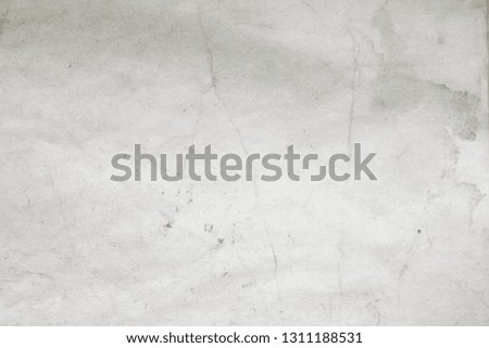 Aged paper sheet. Blank old background with dust and dirty stains. Vintage and antique art concept. Poster mockup. Detailed closeup studio shot. Front view. Toned