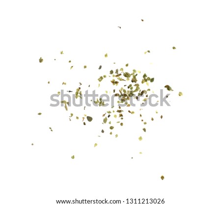Pile of dried oregano isolated on white. Pile of dried oregano leaves on a white background. Spice for pizza. Pizza ingredient. Royalty-Free Stock Photo #1311213026
