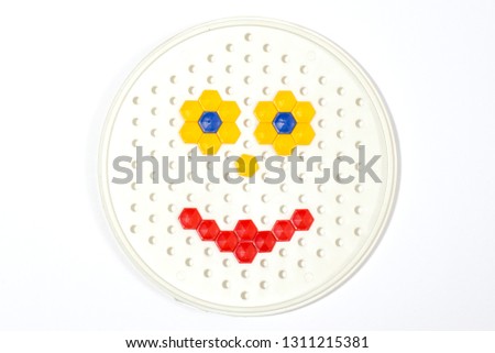 Smiley from mosaic on a white background