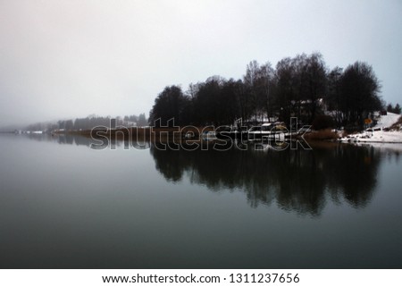 Scenic misty landscape of winter river not far from Turku, Finland