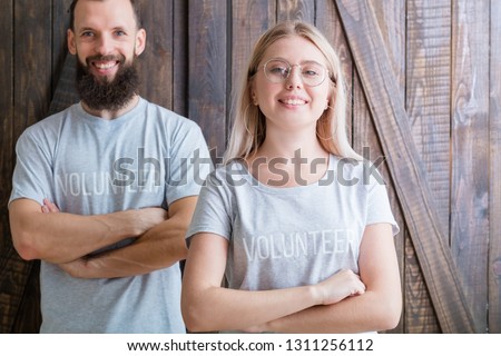 Volunteer youth. Modern family concept. Happy young couple ready to help. Royalty-Free Stock Photo #1311256112