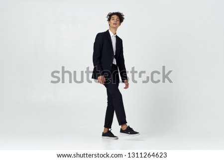 Handsome elegant man in a full-length suit office worker