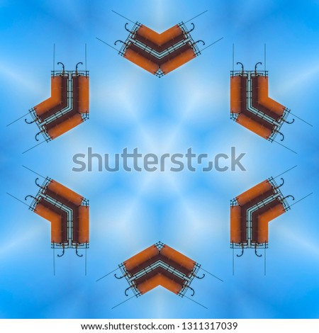 Minimal metal shapes make a symmetrical design. Geometric kaleidoscope pattern on mirrored axis of symmetry reflection. Colorful shapes as a wallpaper for advertising background or backdrop.