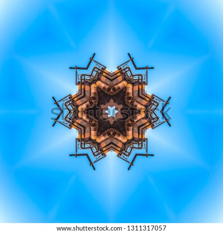 Metallic barrel shapes made from industrial photo. Geometric kaleidoscope pattern on mirrored axis of symmetry reflection. Colorful shapes as a wallpaper for advertising background or backdrop.