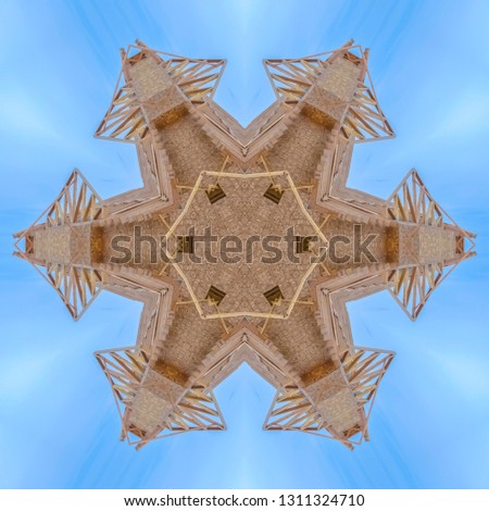 Complex wooden shape made from construction. Geometric kaleidoscope pattern on mirrored axis of symmetry reflection. Colorful shapes as a wallpaper for advertising background or backdrop.