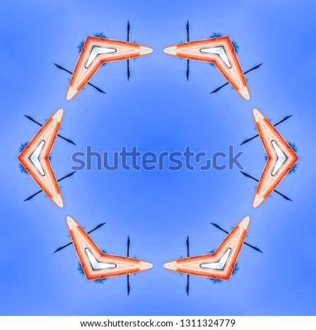 Abstract metal boomerang design made from photo. Geometric kaleidoscope pattern on mirrored axis of symmetry reflection. Colorful shapes as a wallpaper for advertising background or backdrop.