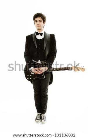 male musician dressed in a frock coat with a guitar