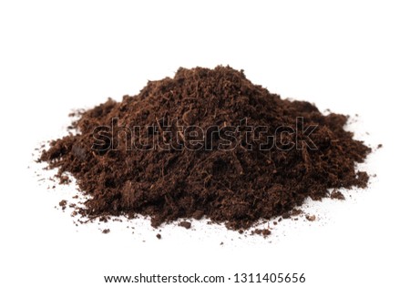Pile of peat soil isolated on white Royalty-Free Stock Photo #1311405656