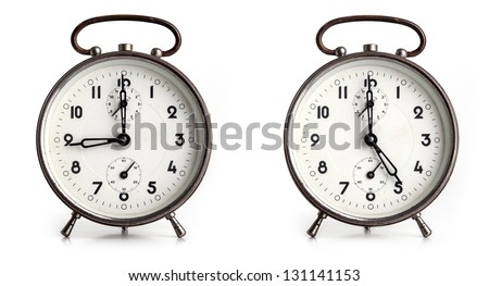 Alarm showing nine to five business working hours, isolated on white background. Royalty-Free Stock Photo #131141153