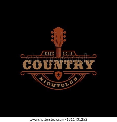 Cowboy Guitar Headstock for Guitarist Band logo, Country Music Fest Western Vintage Retro Saloon Bar logo design Royalty-Free Stock Photo #1311431252
