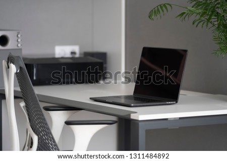 Office space with modern comfortable workspace - computer desk, orthopaedic chair and natural daylight. Well-disigned ergonomics of work place in the office with natural daylighting.