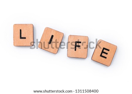 The word LIFE, spelt with wooden letter tiles.