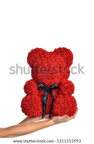 Woman hands hold red bear of roses present gift for valentines day or birthday isolated on white background