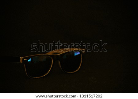 sunglasses on a black backdrop