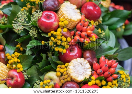 Flower bouquet is designed from local fruits and agriculture products such as apple, chilli, corn and leaf, what a wonderful ideal. Selected focus photo.