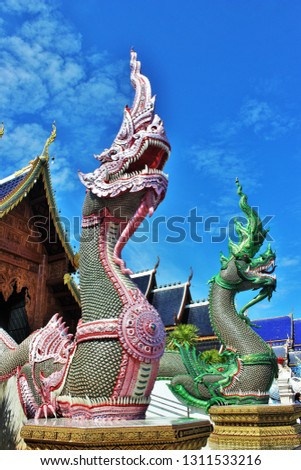 beautiful of  Naga in front of the church at Banden temple, Chiang Mai, Thailand. Naga  statue in front of the Thai temple and sky background. Thai modern  culture.