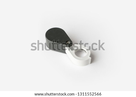 Magnifying glass for diamonds or see the amulet Isolated on a White Background. Eye Lens Magnifier.