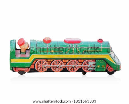 side view antique green toy train zinc on white background, copy space