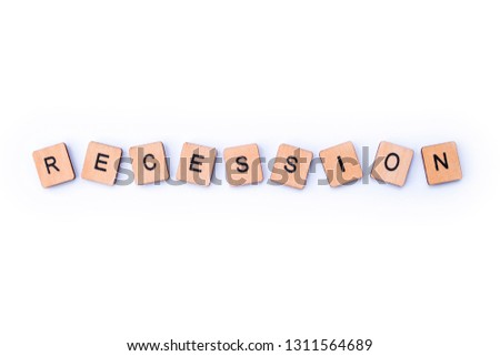 The word RECESSION, spelt with wooden letter tiles.