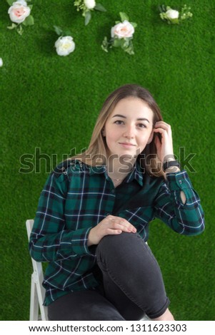studio portrait of a girl on a green background
