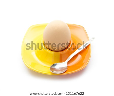 boiled egg in cup isolated on white background