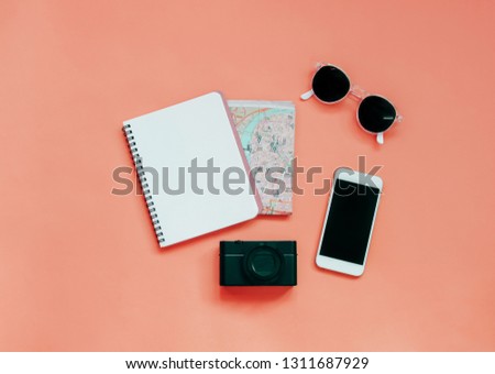 Travel items concept : blank notebook, map, camera, smartphone and sunglasses, top view with minimal style