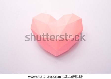 Paper hearth with shadow. Pink polygonal paper heart for