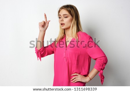   woman pointing her finger to a free spot                             