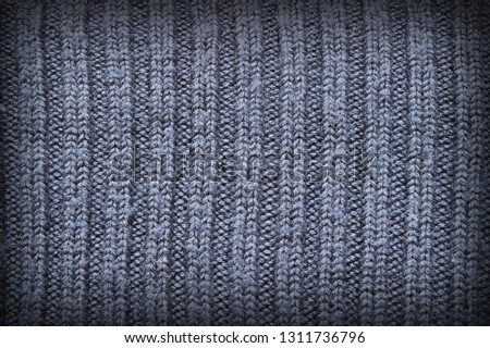 Black knitted wool cloth texture, vignetting effect