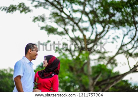 Young loving couple at park