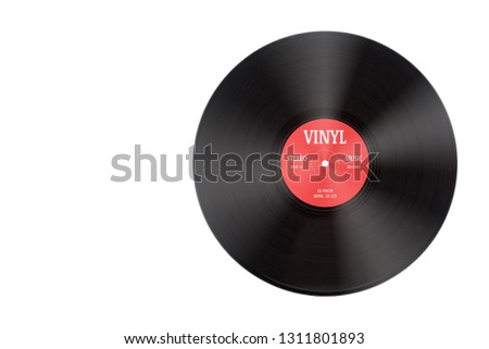 Closeup view of gramophone vinyl LP record or phonograph record with red label. Black musical long play album disc size 12 inch 33 rpm spiral groove. Stereo sound record. Isolated on white background. Royalty-Free Stock Photo #1311801893